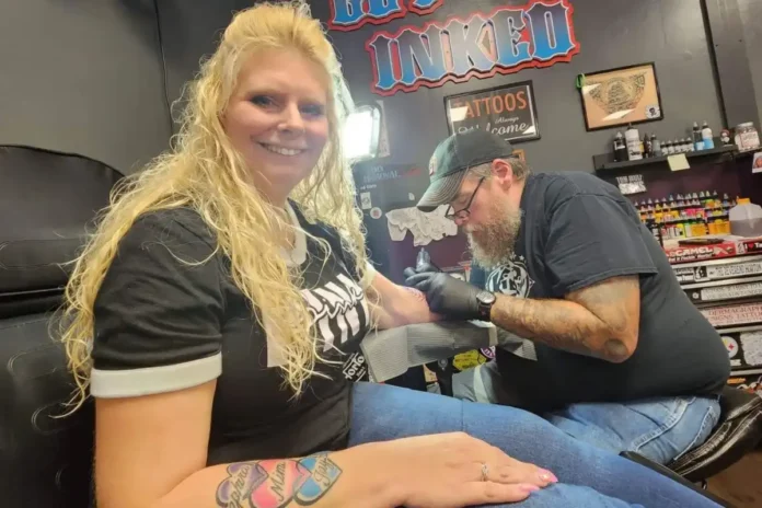 Tanya Kach getting inked to cover her scar.